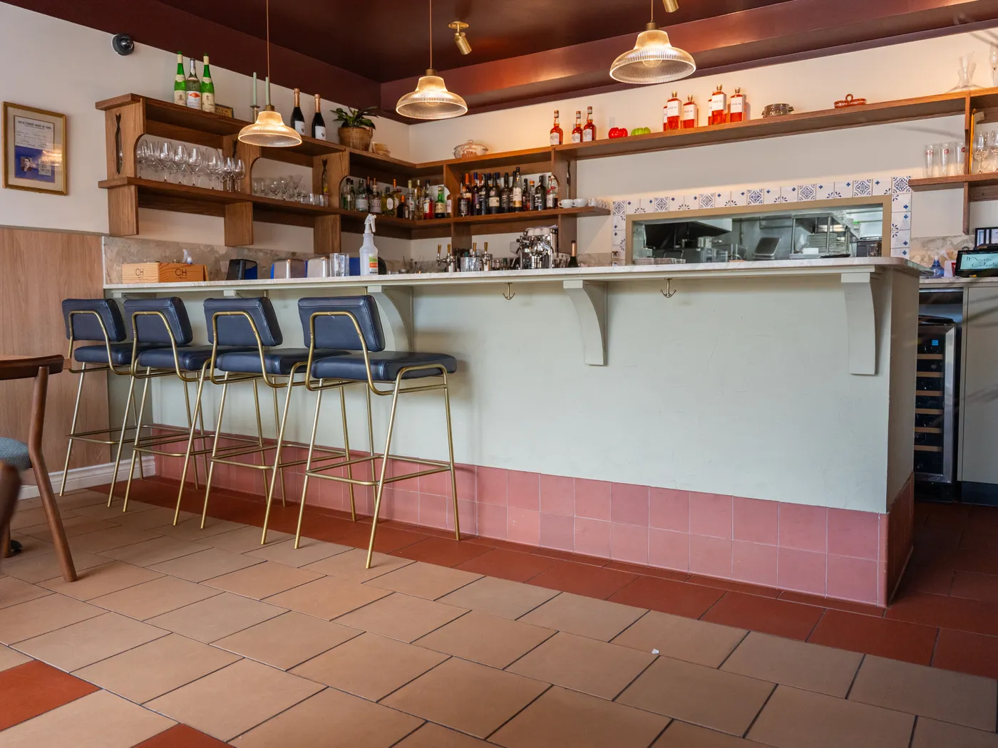 Restaurant bar with stools and shelving