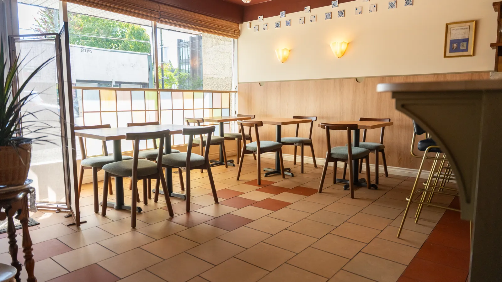 Restaurant dining room with terracotta tile and wood panelling