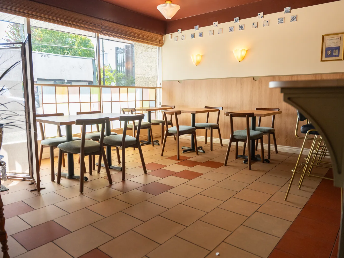 Restaurant dining room with terracotta tile and wood panelling